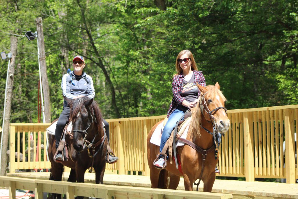 Man and woman horseback riding